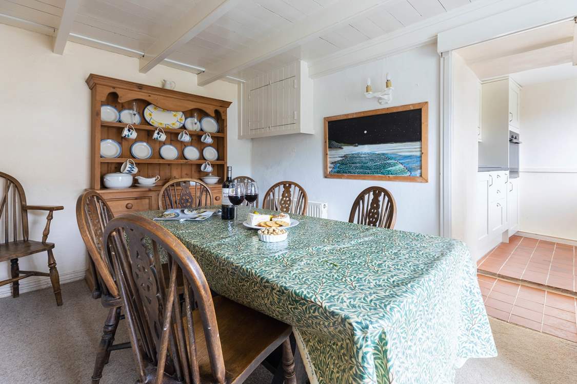 Pull up a chair for a perfect family games night.
(The fridge/freezer, washing machine and microwave are also in the dining-room).