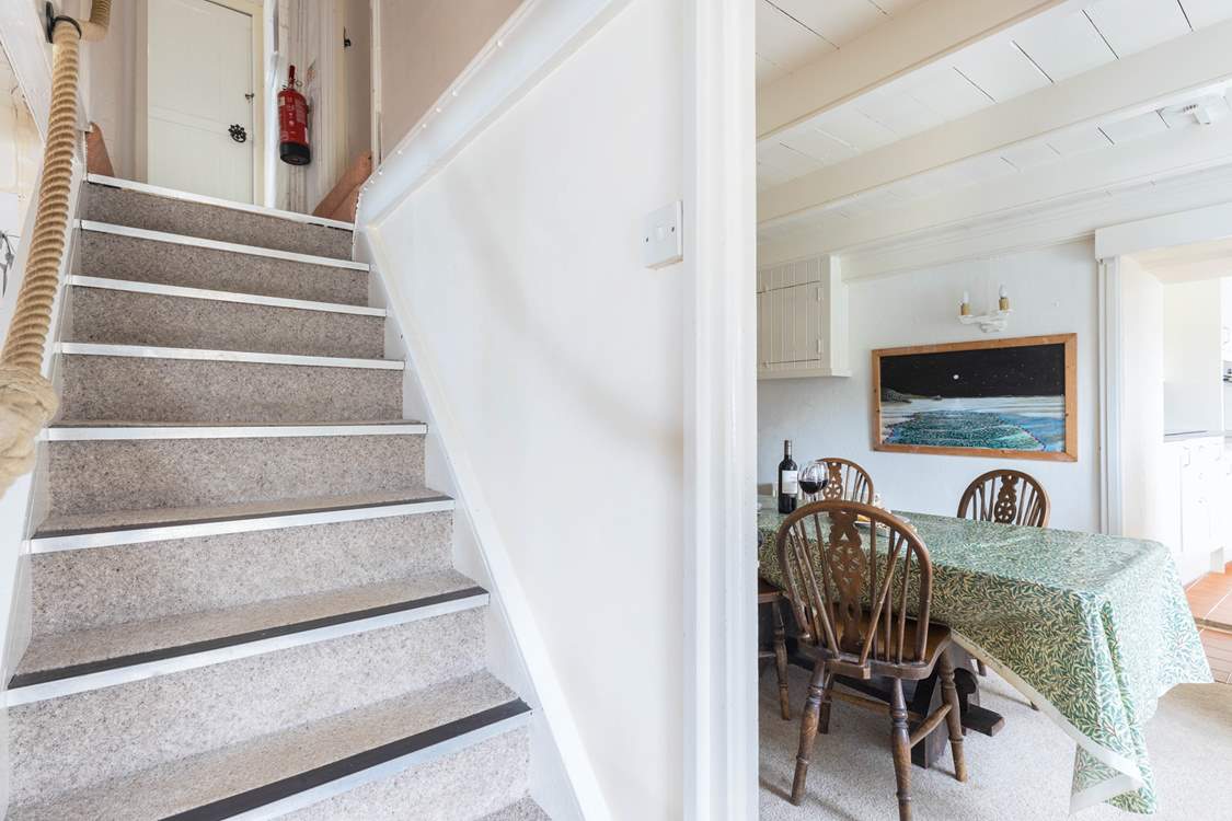 The steep central staircase leads up to the bedrooms, family bathroom, games-room and top terrace. Please watch your head at the bottom of the stairs.