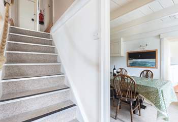 The steep central staircase leads up to the bedrooms, family bathroom, games-room and top terrace. Please watch your head at the bottom of the stairs. 