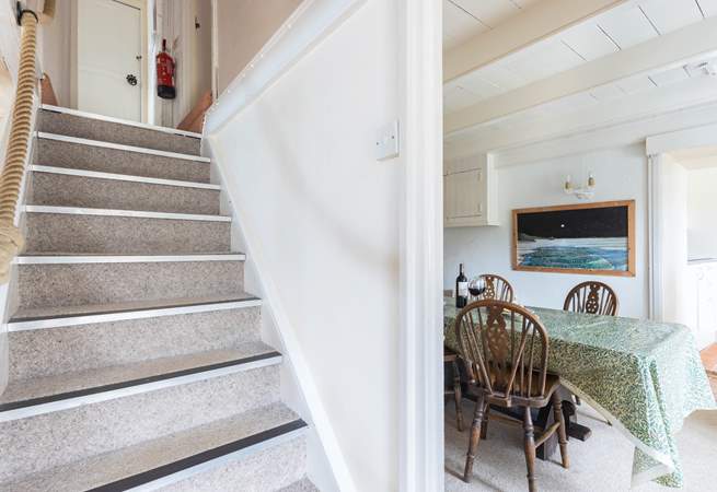 The steep central staircase leads up to the bedrooms, family bathroom, games-room and top terrace. Please watch your head at the bottom of the stairs. 