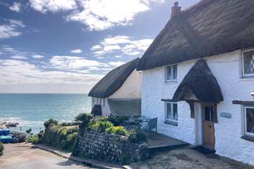 Pink Cottage is the last cottage on the right, perched next to the water and what a view.