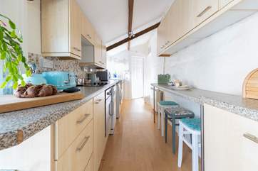 The kitchen has a handy breakfast-bar, perfect for a quick snack.