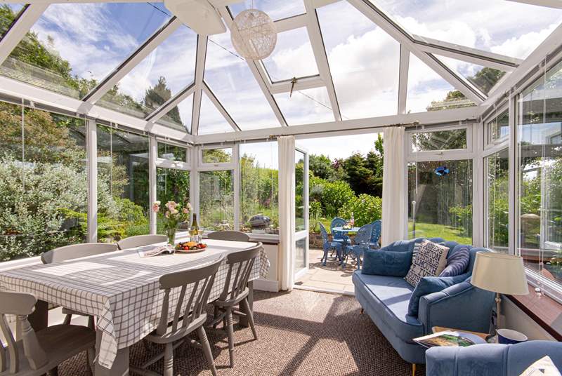 The fabulous conservatory overlooks the south-facing gardens.