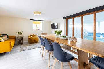The sitting/dining-room has a fabulous view of the pool.
