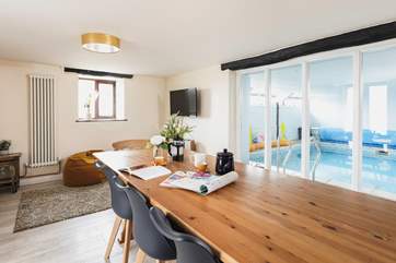 The sitting/dining-room has a fabulous view of the pool.