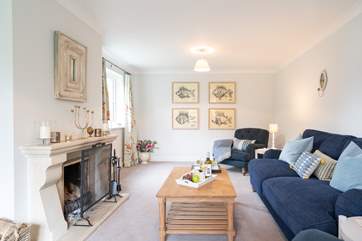 The gorgeous sitting-room is the perfect place to curl up in front of the open fire.