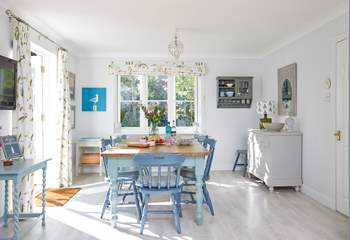 The welcoming open plan kitchen with an inviting dining area is light and spacious.