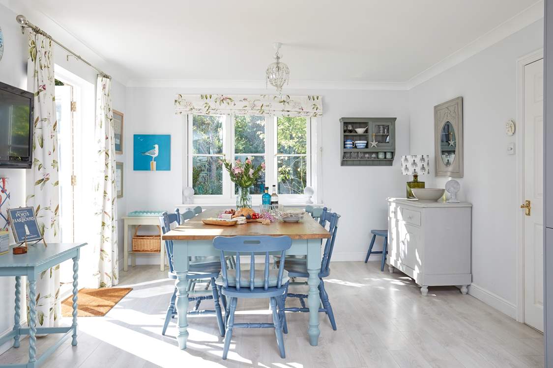 The welcoming open plan kitchen with an inviting dining-area is light and spacious.