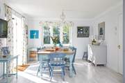 The welcoming open plan kitchen with an inviting dining-area is light and spacious.