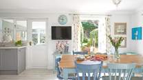 The kitchen table over looks the garden.