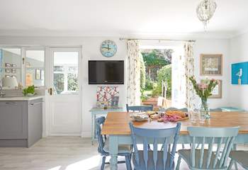 The kitchen table over looks the garden.