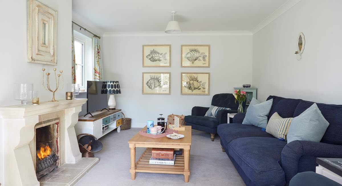 The gorgeous sitting-room is the perfect place to curl up in front of the open fire. 