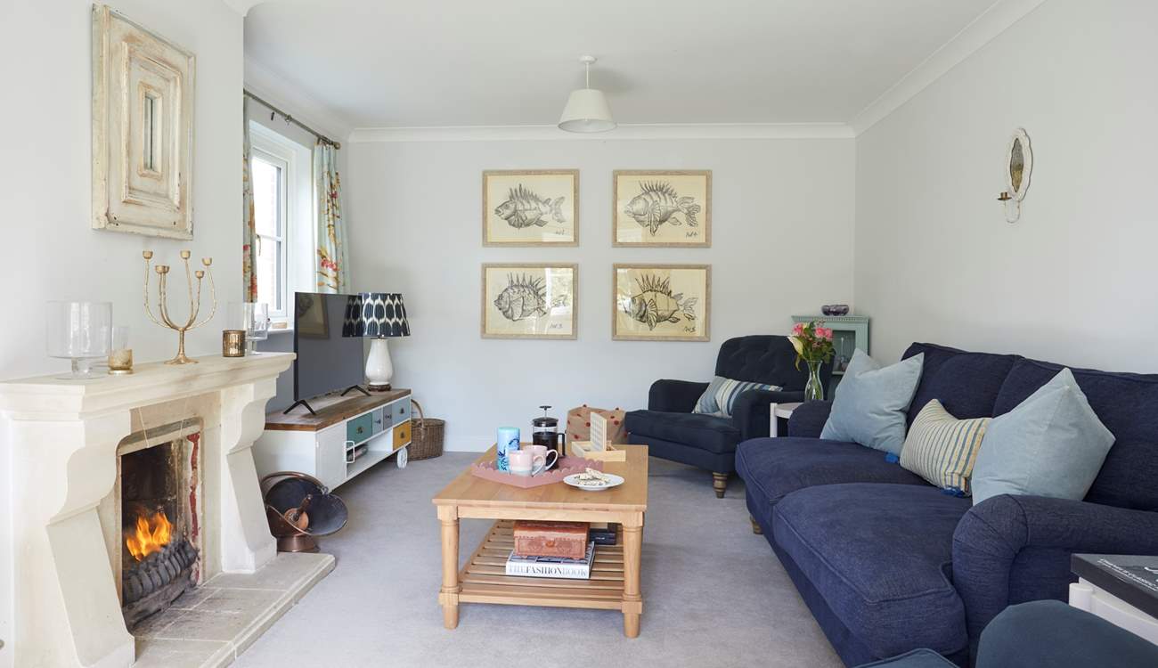 The gorgeous sitting-room is the perfect place to curl up in front of the open fire. 