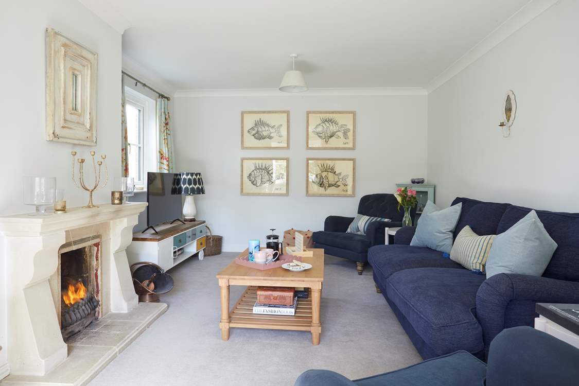 The gorgeous sitting-room is the perfect place to curl up in front of the open fire.
