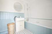 The family bathroom on the first floor, perfect for a relaxing soak.