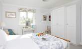 The lovely main bedroom overlooks the garden. - Thumbnail Image