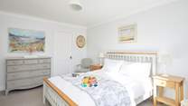 The main bedroom on the first floor is a delight and has the added benefit of an en suite bathroom.