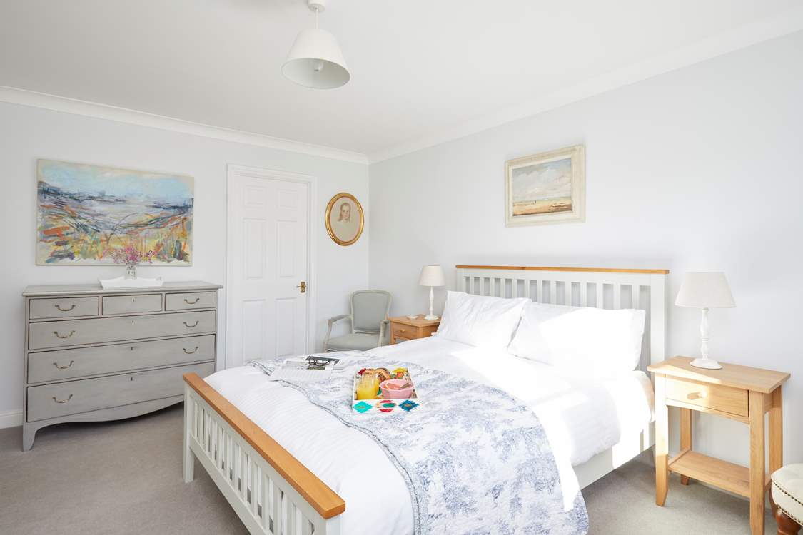 The main bedroom on the first floor is a delight and has the added benefit of an en suite bathroom.