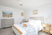 The main bedroom on the first floor is a delight and has the added benefit of an en suite bathroom.