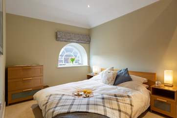 The bedroom is a relaxing haven with a delightful Scandinavian style bed (lower than some standard divans).