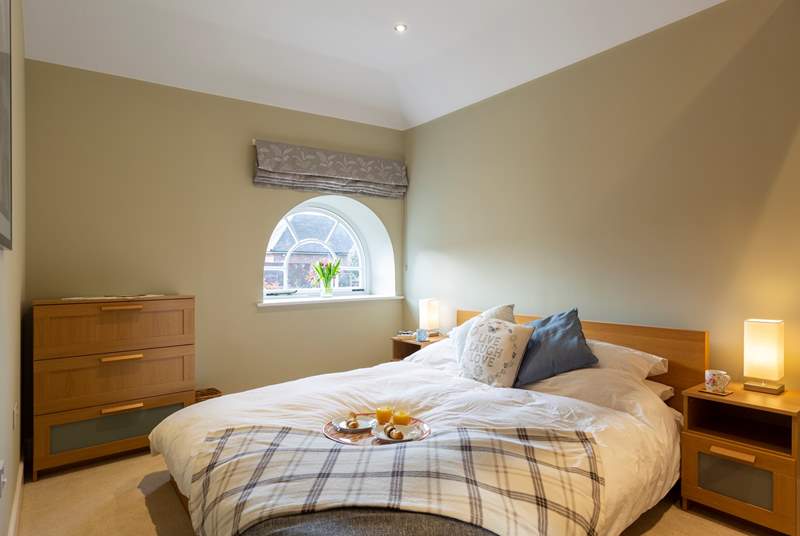 The bedroom is a relaxing haven with a delightful Scandinavian style bed (lower than some standard divans).