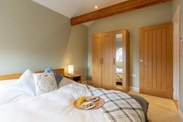 The bedroom has plenty of storage space.