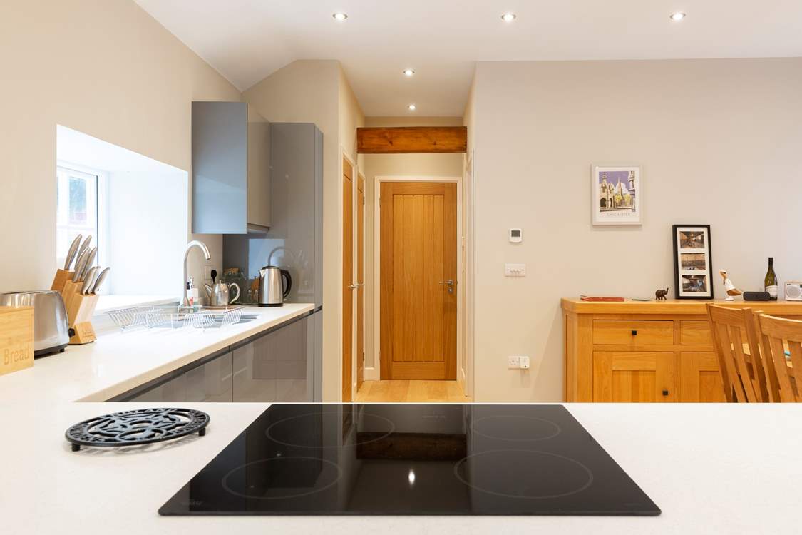 A view from the kitchen looking towards the bathroom and bedroom.