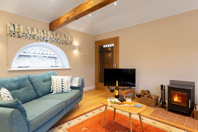 Curl up on the sofas and enjoy cheese and wine in front of the roaring wood-burner.