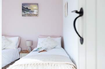 The twin bedroom overlooks the quadrangle of cottages to the front.