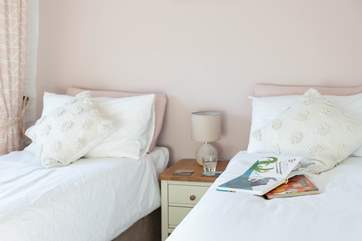 The stylish twin bedroom looks out over the courtyard.