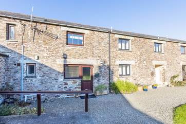 Mill Cottage sits in a terrace of pretty barn conversions.