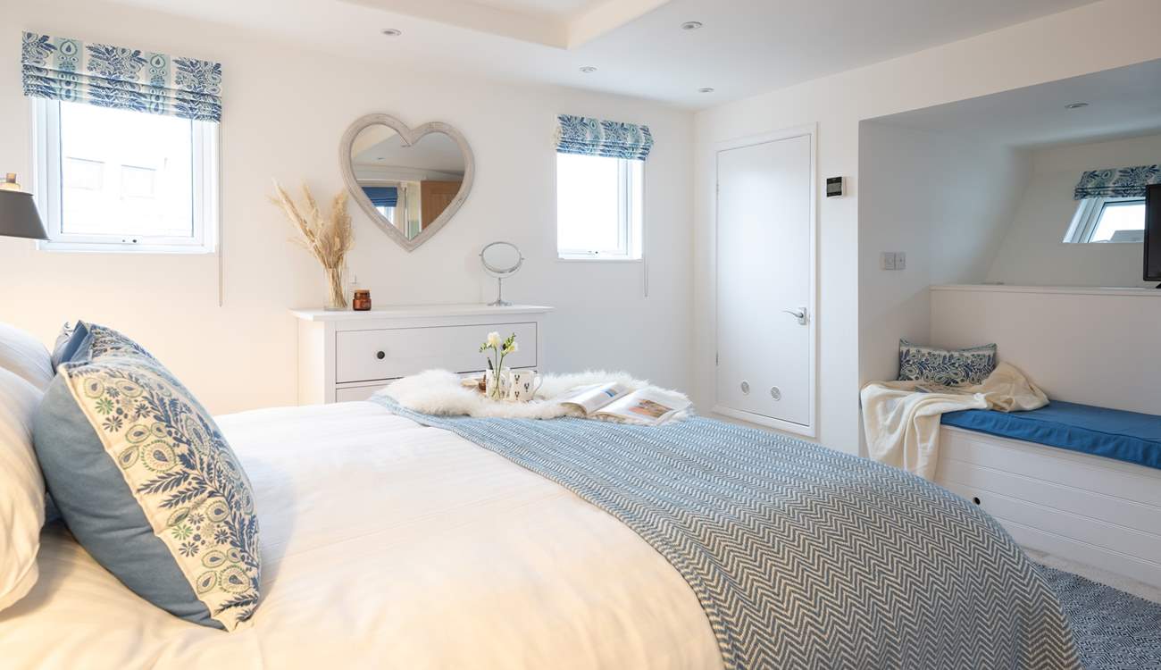 The very essence of a seaside holiday, bedroom 1 is decorated in blue and white shades and has a luxurious super-king size bed.