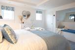 The very essence of a seaside holiday, bedroom 1 is decorated in blue and white shades and has a luxurious super-king size bed.