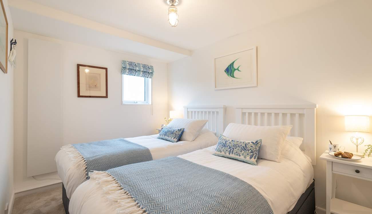 The pretty twin bedrooms have lovely linens.
