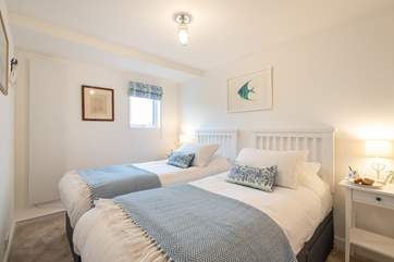 The pretty twin bedrooms have lovely linens.