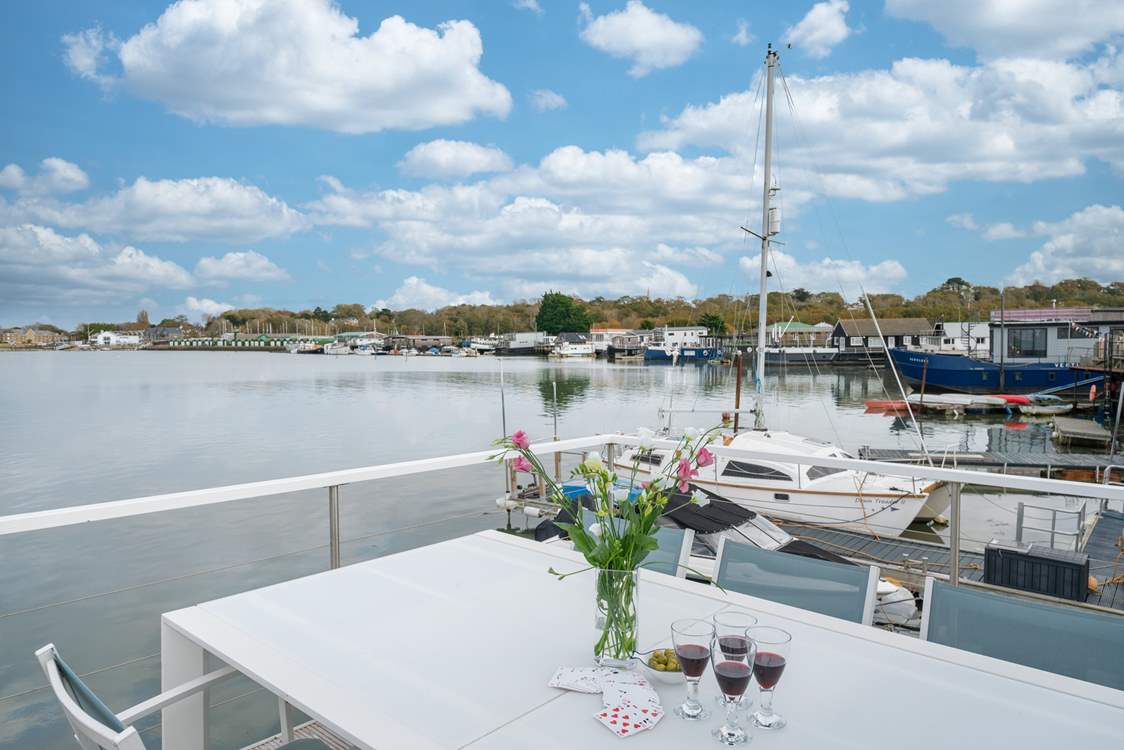 Watch the tide ebb and flow from the deck and admire the surrounding houseboat community.