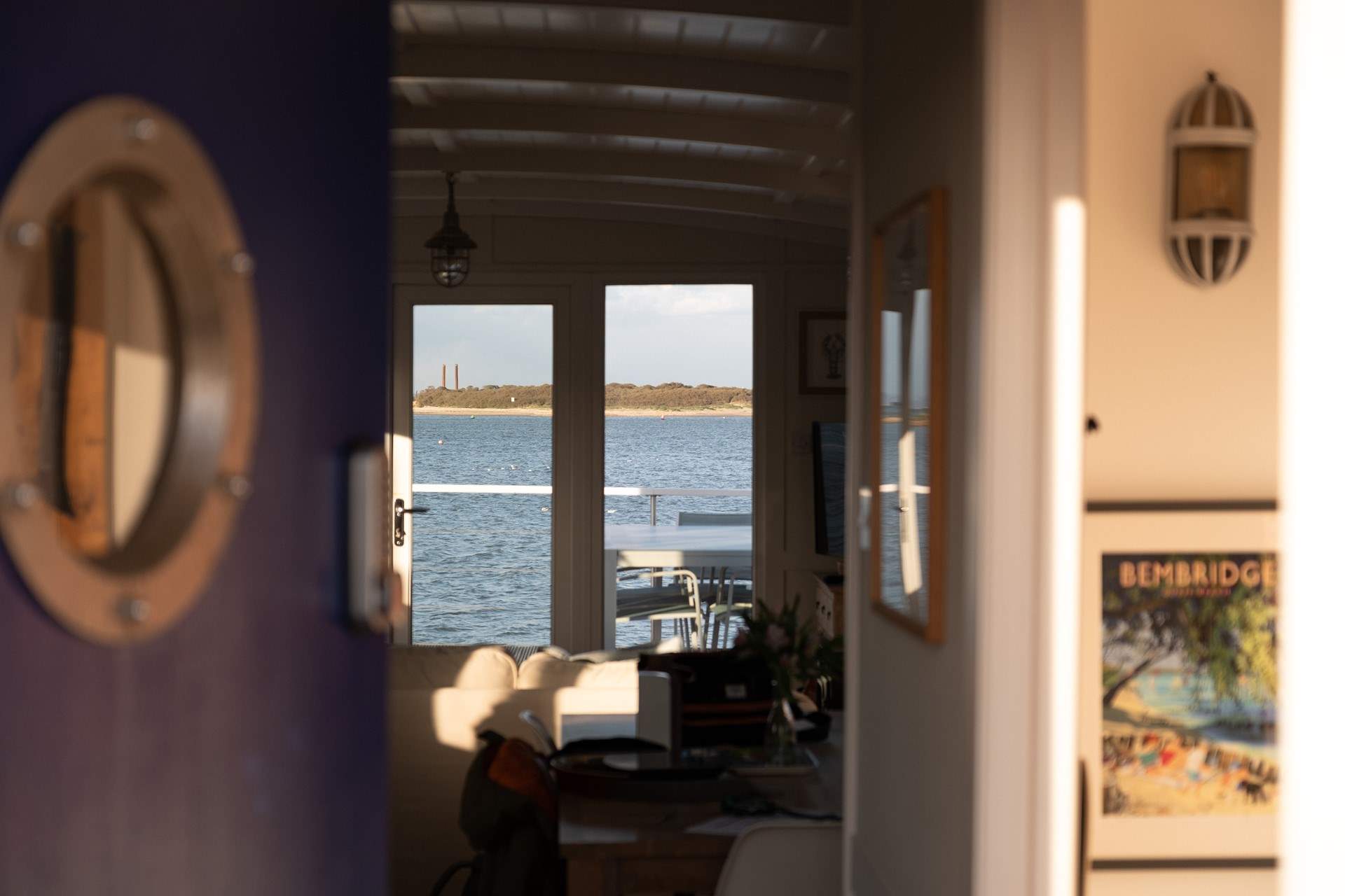 Step through the charming blue porthole door and instantly feel at home.