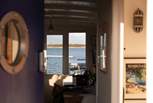 Step through the charming blue porthole door and instantly feel at home.