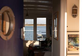 Step through the charming blue porthole door and instantly feel at home.