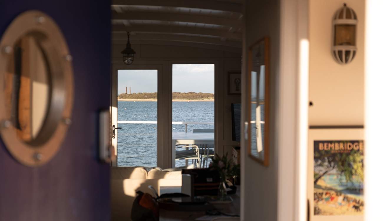 Step through the charming blue porthole door and instantly feel at home.