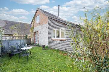 You have a private area of garden but please note it is not fully enclosed. The owners' house is visible behind The Cider Shed.
