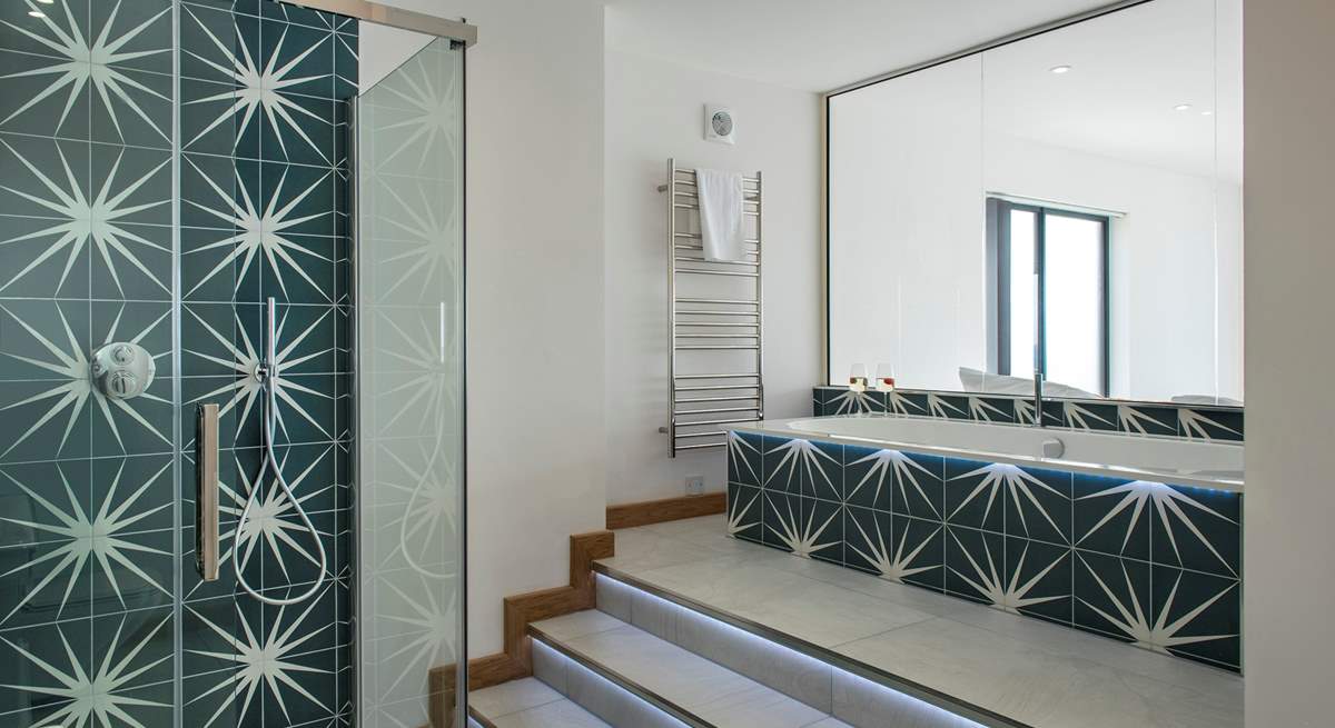 The en suite is a real luxury with a separate shower and LED lit steps leading up to the bath, so you can change the colour to suit your mood.