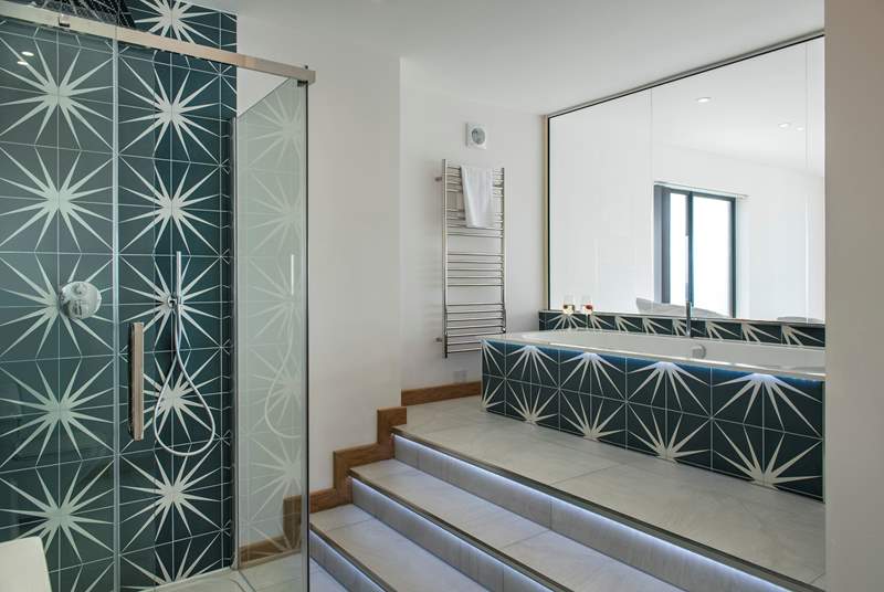 The en suite is a real luxury with a separate shower and LED lit steps leading up to the bath, so you can change the colour to suit your mood.