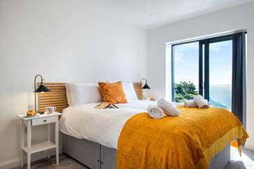 Bedroom 3 on the second floor is a delightful room with a huge picture window that you can slide open to savour the sound of the sea.