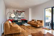 The sitting-room leads out to the side terrace with its built-in barbecue and bubbly hot tub - bliss.