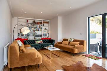 The sitting-room leads out to the side terrace with its built-in barbecue and bubbly hot tub - bliss.