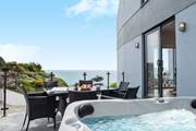Step out onto the terrace to fire up the barbecue or to treat yourself to a soak in the hot tub.