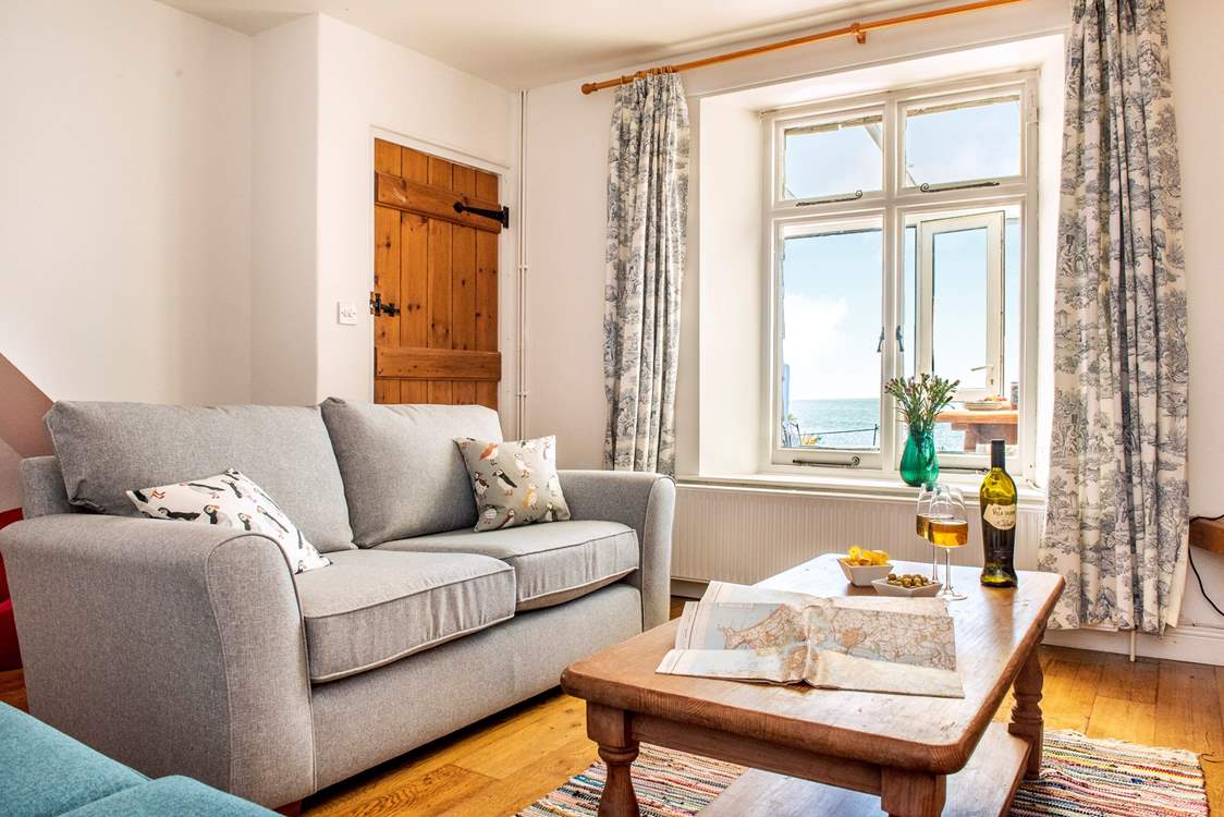 The sitting-room is light and airy...