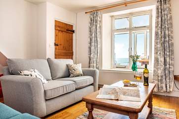 The sitting-room is light and airy...