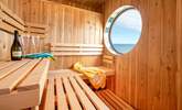 Look out over the sea as you sip some bubbles and enjoy the sauna. - Thumbnail Image